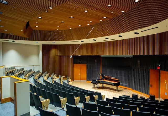 Stanford University music classroom with grand piano, ideal for performances and meetings.