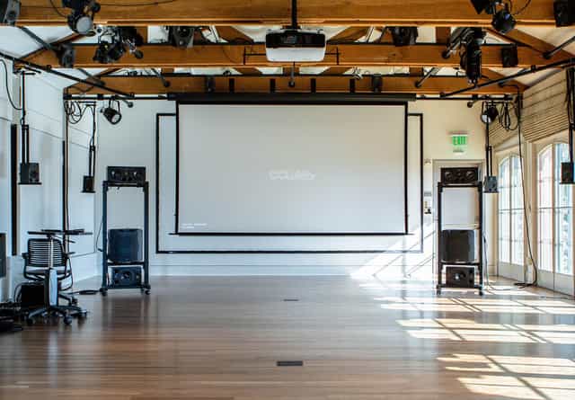 Stanford University music classroom with projection screen for events and presentations.