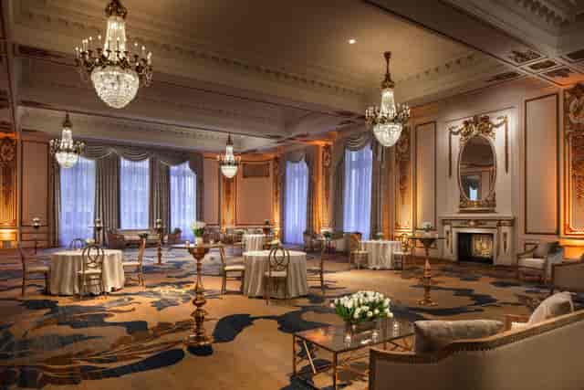 Elegant event space with chandeliers for upscale meetings and receptions at Maji Palace LLC.