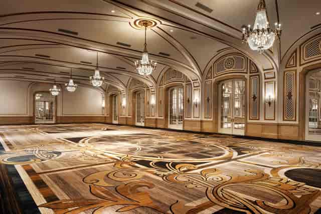 Elegant event space at Maji Palace with chandeliers, ideal for weddings and galas.