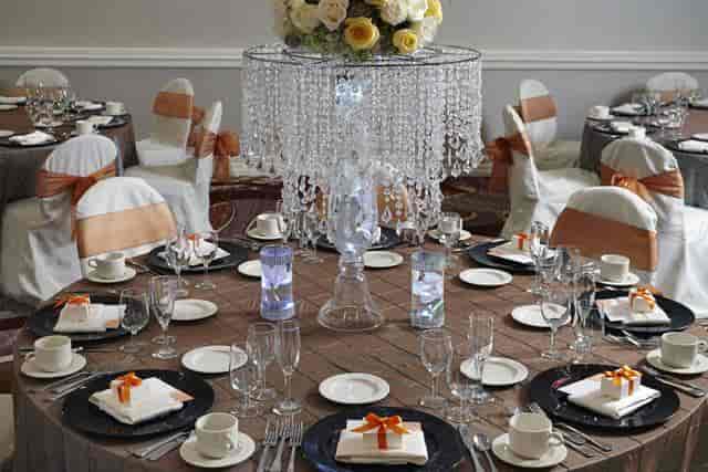 Elegant banquet table with floral centerpiece in Champagne Ballroom, perfect for weddings and events.