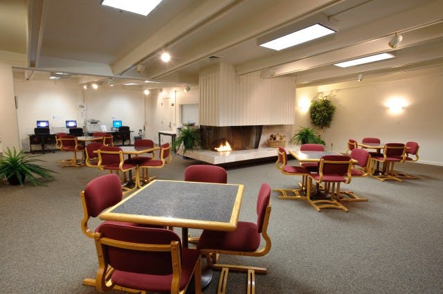 Fireside meeting space at NASA Ames with cozy fireplace, ideal for gatherings and presentations.