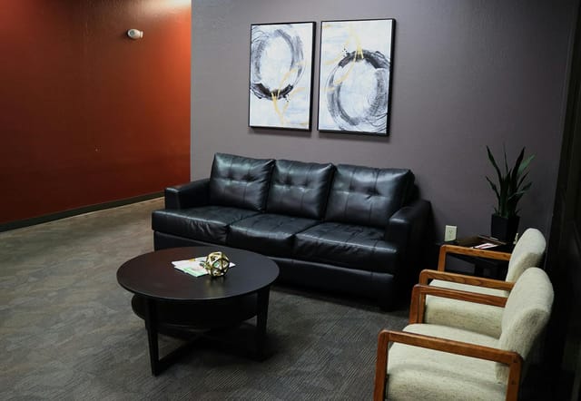 Private cubicles in Wave Tech Center with modern couch for networking and meetings.