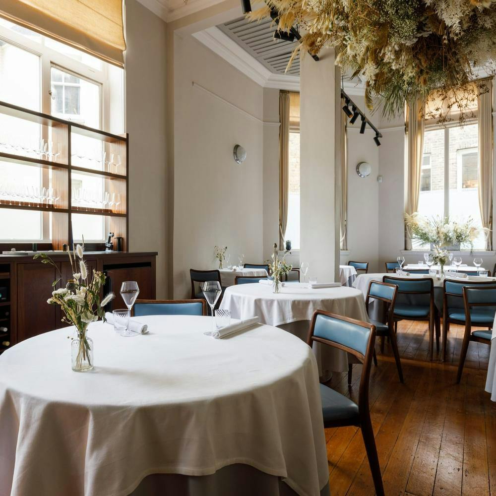 Stylish dining space with elegant table settings for intimate gatherings or corporate events.
