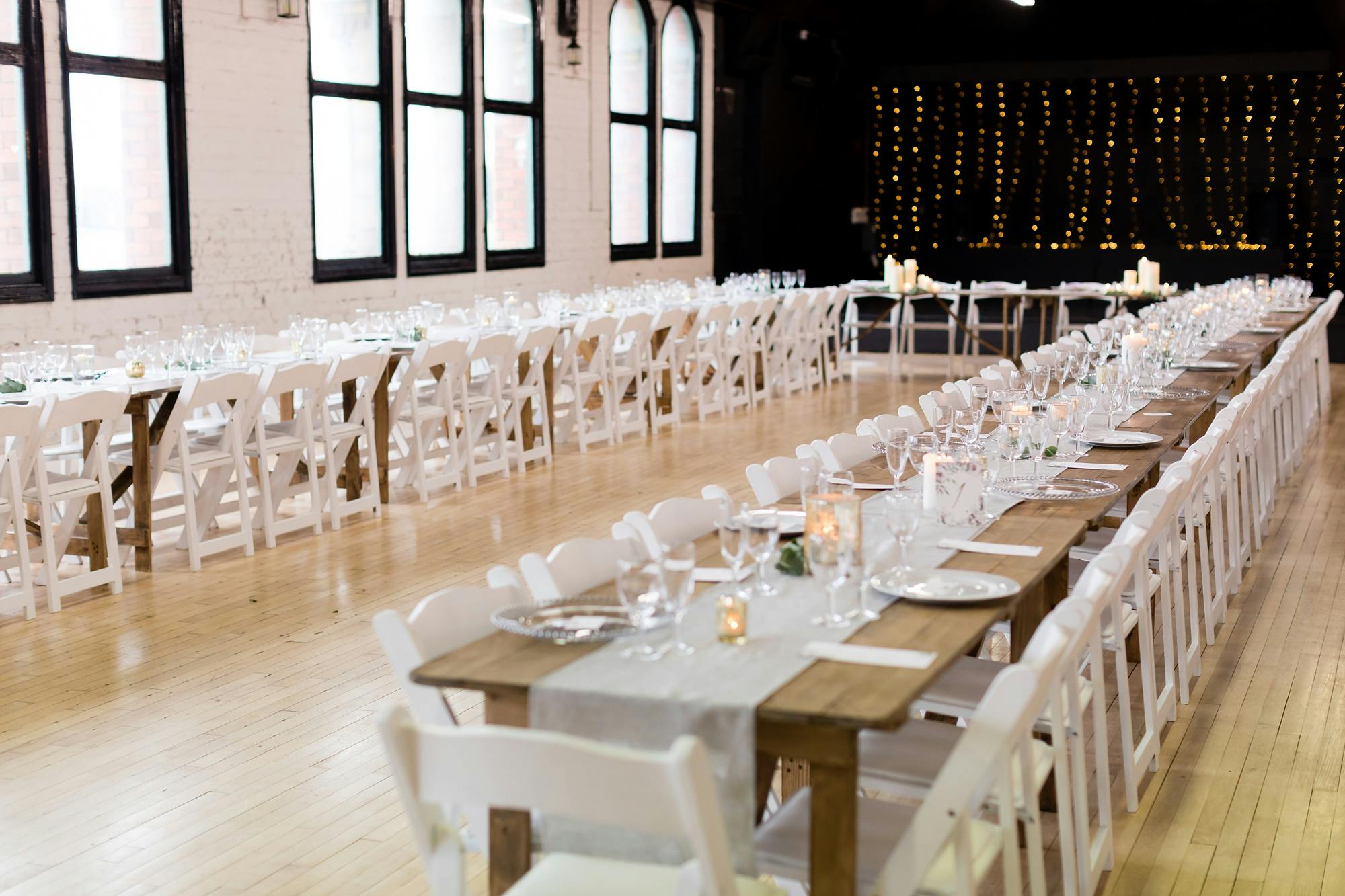 Banquet-style ballroom with elegant tables, perfect for weddings and corporate events.