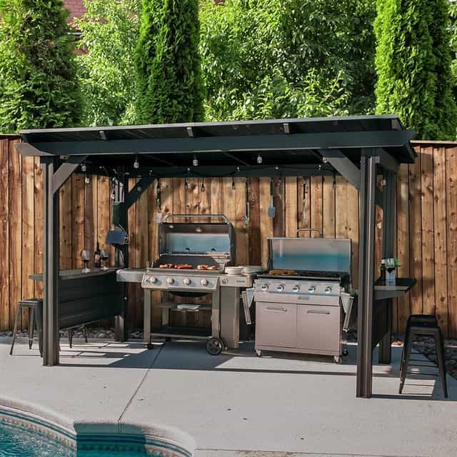 Outdoor patio grilling station at The Hook Bar and Grill for summer networking events.