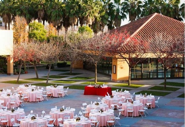 Pavilion at Mexican Heritage Plaza with pink table linens for romantic outdoor events.