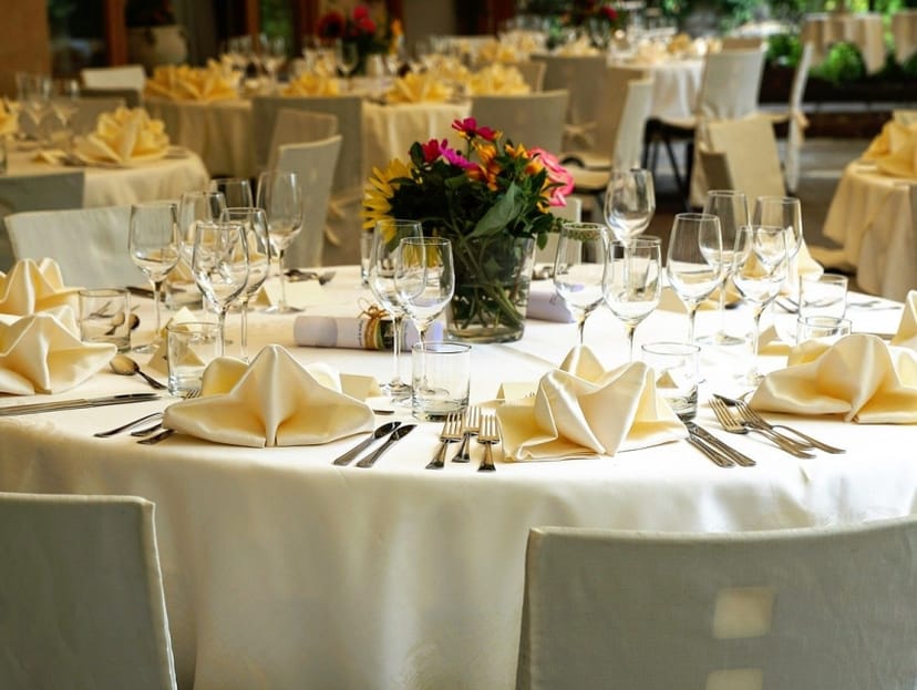 Elegant dining table with fresh flowers at Pavilion, Mexican Heritage Plaza event.