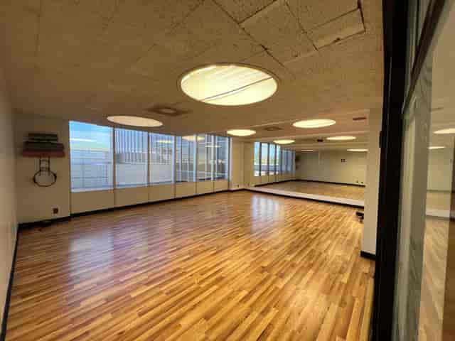 Spacious Studio M Ballroom with natural light, ideal for workshops and events.