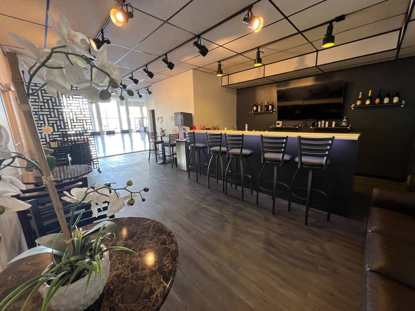 Modern Studio M Ballroom venue with sleek bar, perfect for meetings and receptions.