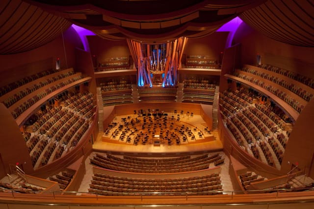 Stunning concert hall with tiered seating for concerts and corporate events.