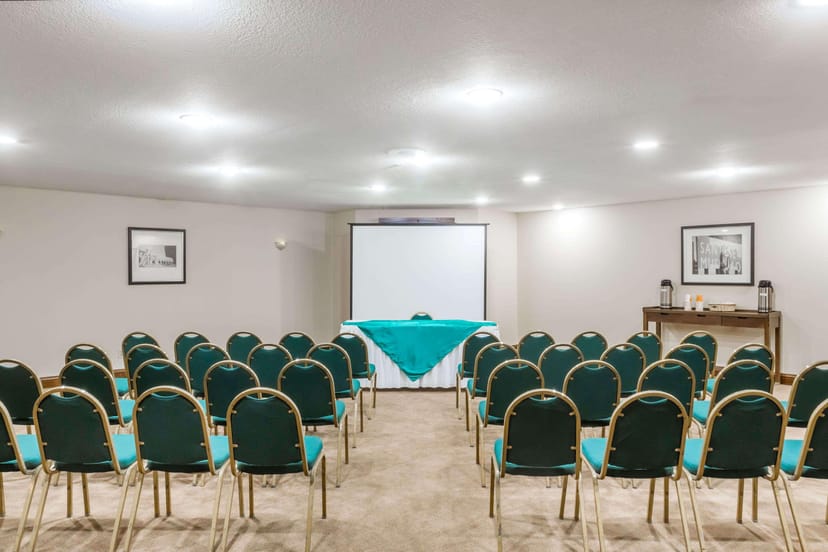 Executive Boardroom at Wyndham Garden, green chairs, ideal for meetings and workshops.