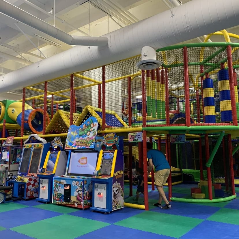Vibrant indoor play area with colorful climbing structures for kids' birthday parties.