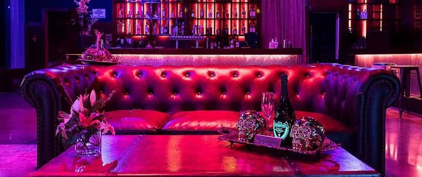 Luxurious lounge with plush red seating, ideal for upscale events and gatherings.