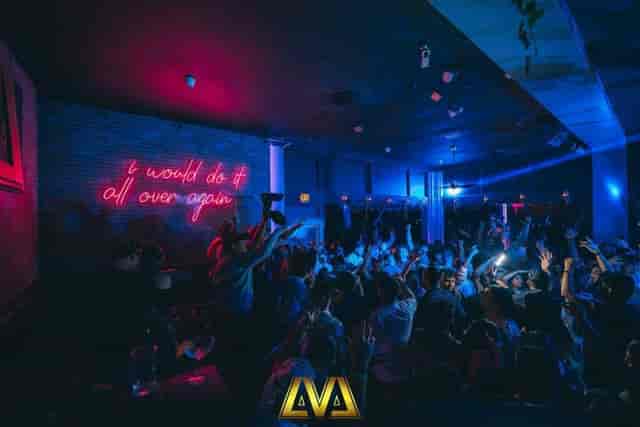 Vibrant LVL 44 lounge with neon sign, perfect for lively events and celebrations.