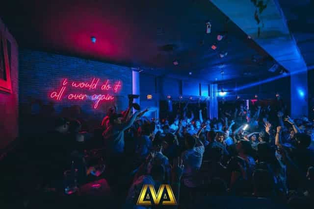 Vibrant LVL 44 lounge with neon sign, perfect for lively events and celebrations.