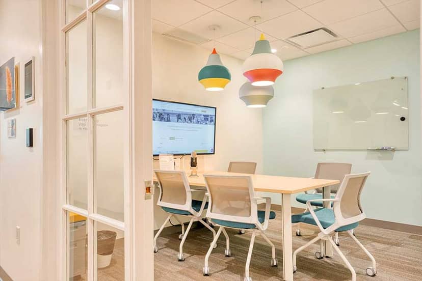 Modern meeting room with sleek table, ideal for corporate events and presentations.