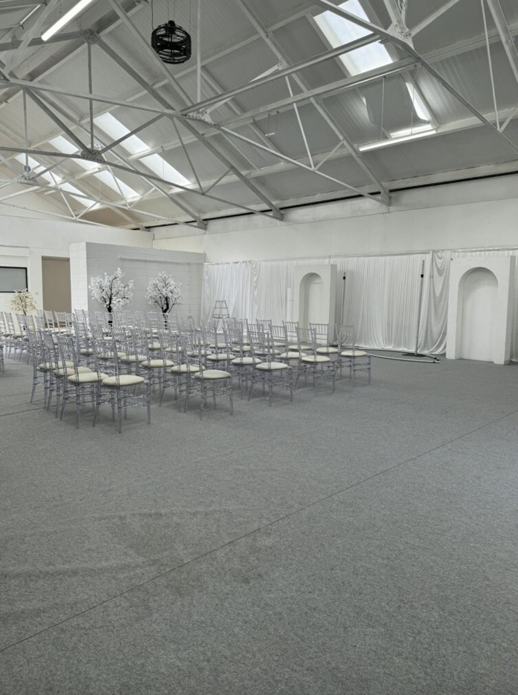 Elegant event space with chiavari chairs, perfect for weddings or corporate gatherings.