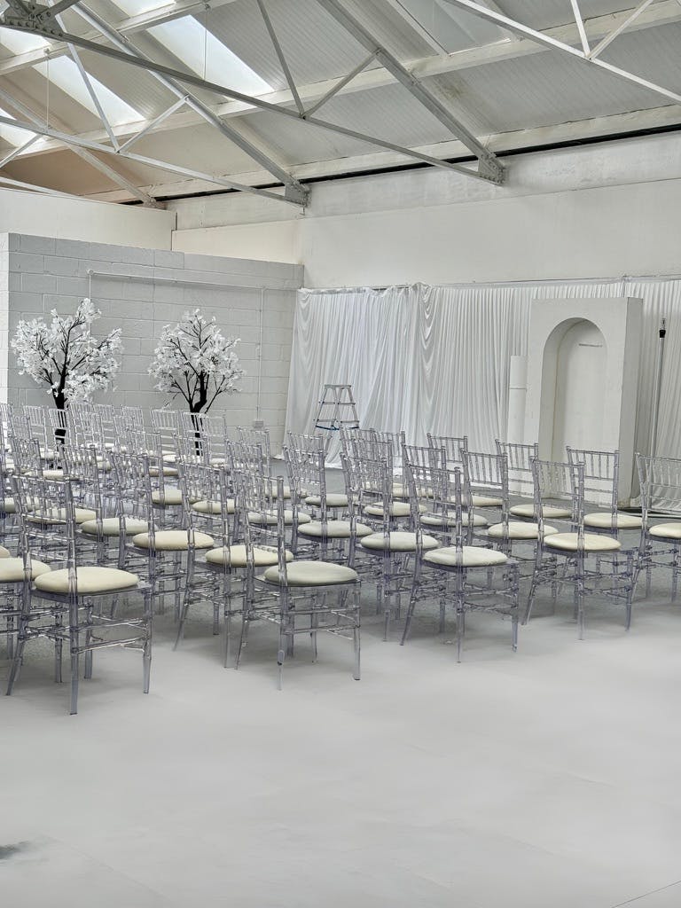 Elegant event space with chiavari chairs for stylish ceremonies and presentations.
