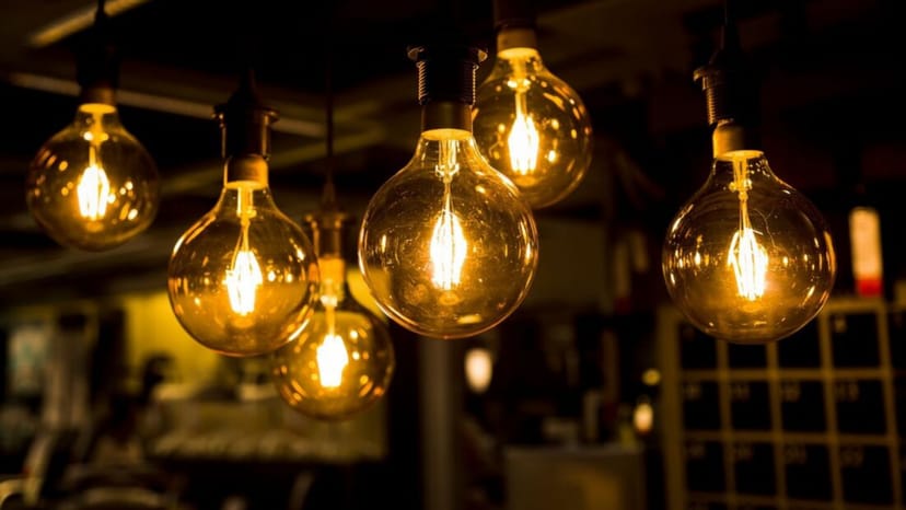 Vintage light bulbs in The James Grain Warehouse event space for warm gatherings.
