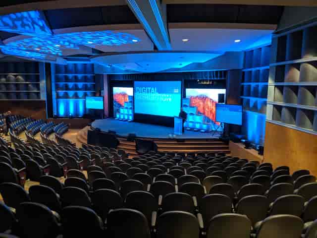 Theater at Santa Clara Convention Center for a digital transformation event with blue lighting.