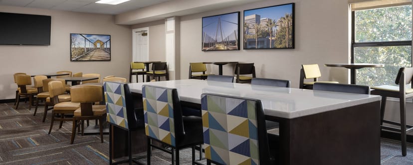 Modern meeting space with high-top tables for networking at Residence Inn Sunnyvale.