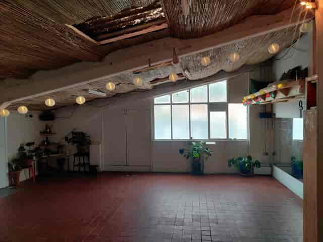 Cozy Smai House of Life event space with warm lighting for gatherings and workshops.