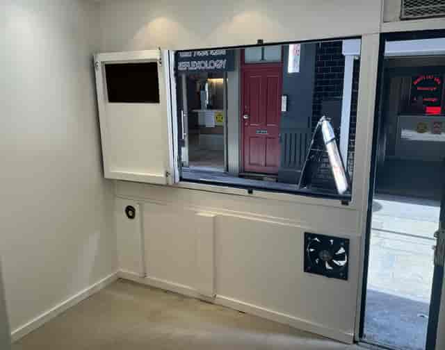 Versatile event space with large window for natural light, ideal for gatherings and pop-ups.