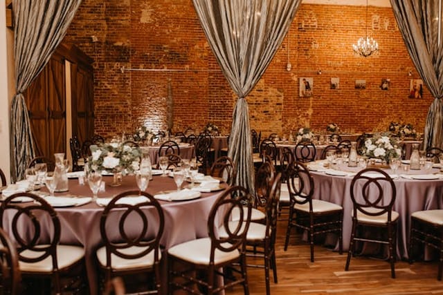 VIP Lounge at The Century with elegant lavender tables, perfect for weddings and upscale events.