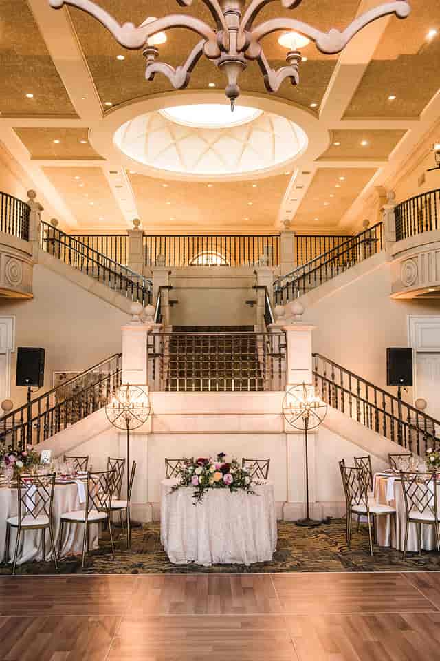 Elegant conference room with grand staircase, ideal for upscale events and receptions.