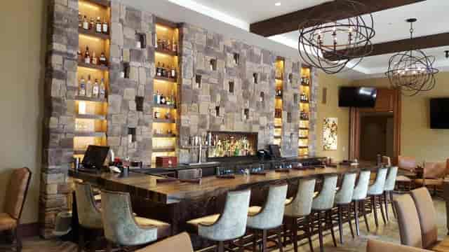 Stylish bar area at Grille Patio, modern design, ideal for networking events.
