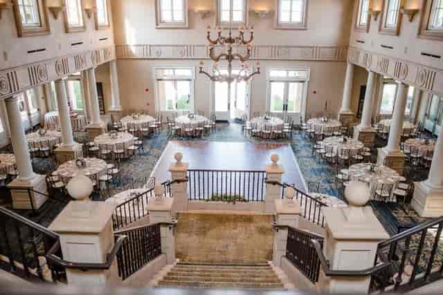 Elegant Grille Patio venue with grand staircase, perfect for weddings and corporate events.
