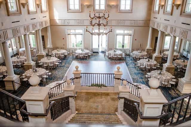 Elegant Grille Patio venue with grand staircase, perfect for weddings and corporate events.