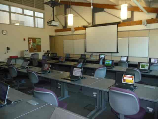Emerald City Room with modern classroom setup for meetings and training events.