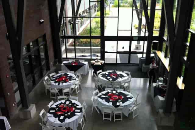 Grand Hall at Green River Conference Center with elegant round tables for events and gatherings.