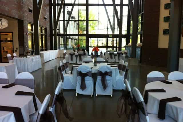 Grand Hall at Green River Center, spacious venue with elegant tables for events and gatherings.