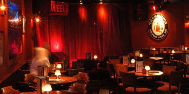 Cozy full venue rental at McGonigel's Mucky Duck for intimate gatherings and performances.