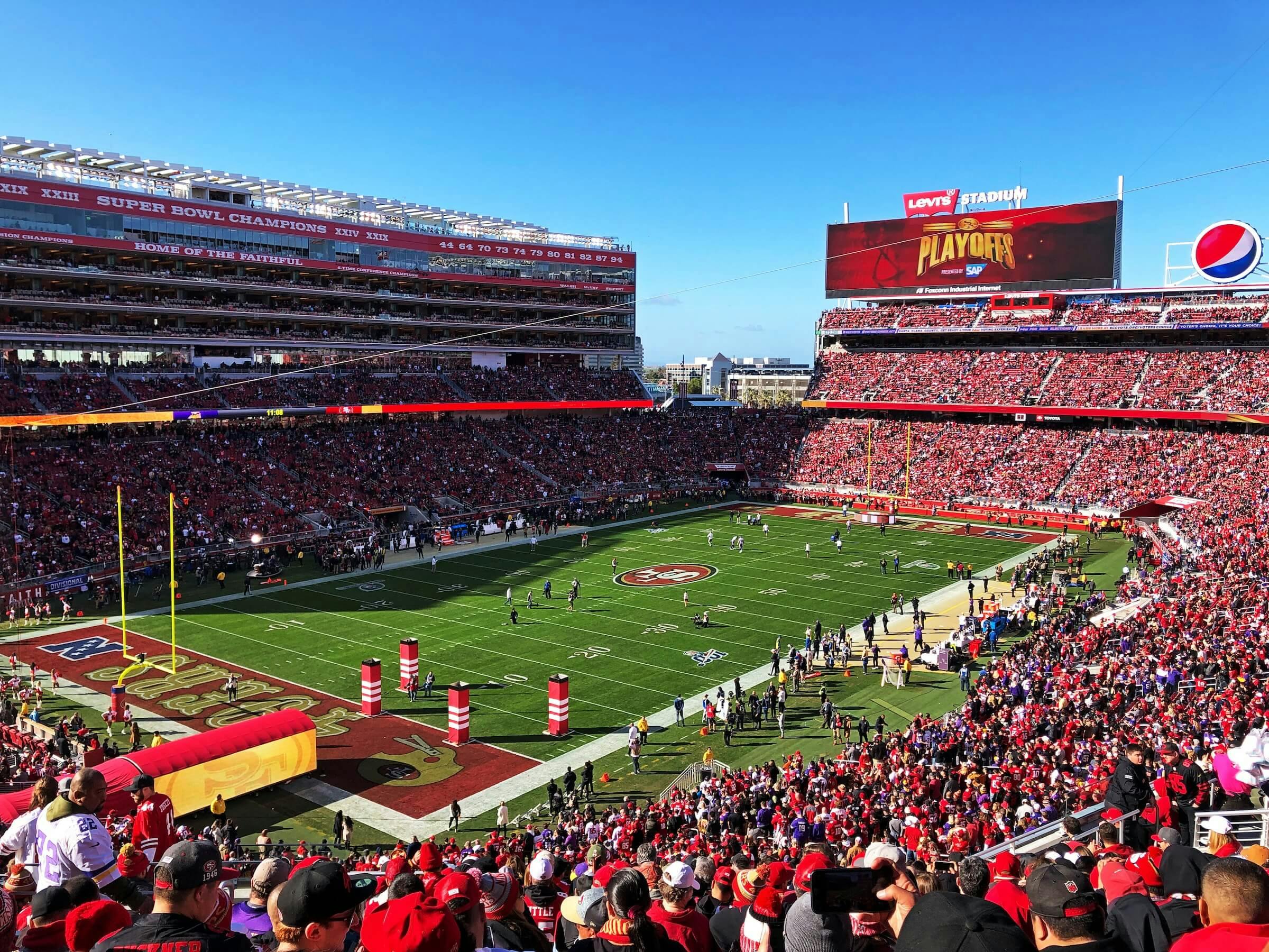 Vibrant Levi's Stadium filled with fans, perfect for sports events and corporate gatherings.