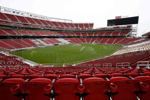 Visa Box Office at Levi's Stadium with empty red seats, ideal for sports and concerts.