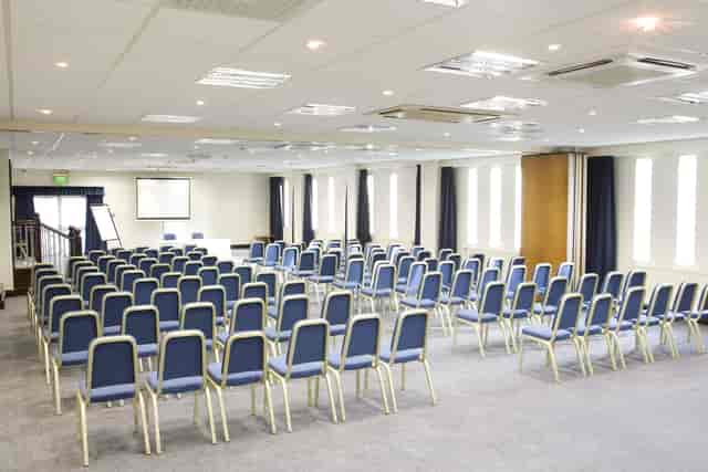 St David's Suite at Mercure Cardiff North Hotel, ideal for conferences with blue chairs.