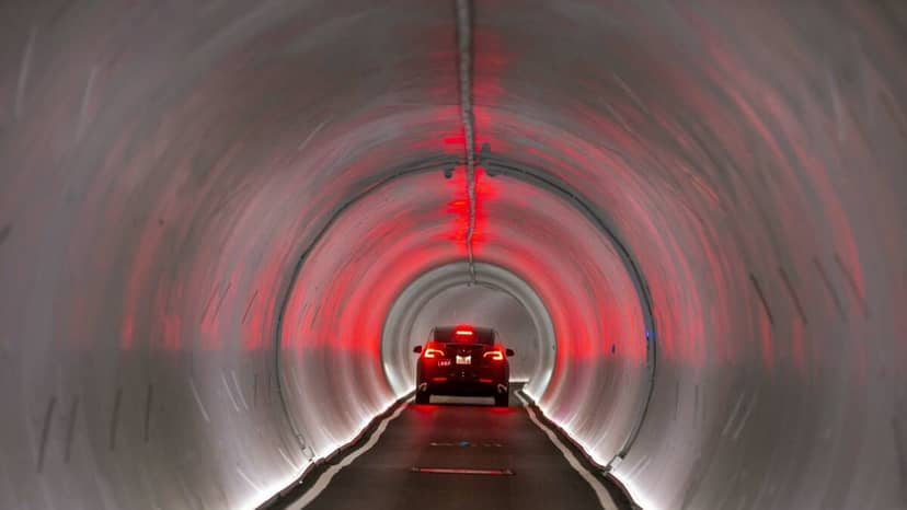 Sleek illuminated car tunnel, ideal for unique event venues and memorable experiences.