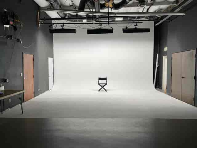Minimalist studio space with clean backdrop for meetings and presentations.