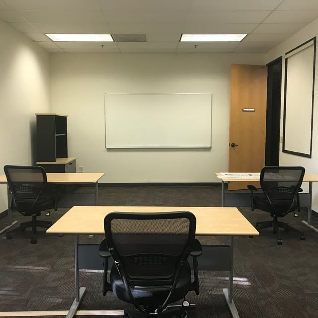 Medium Conference Room with ergonomic chairs, ideal for workshops and training sessions.