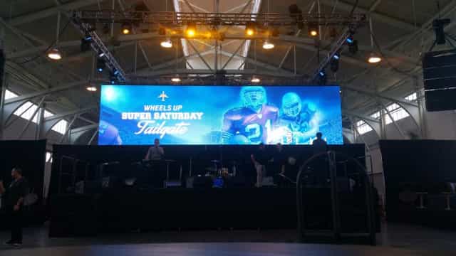 Stage setup with LED screen for Super Saturday Tailgate event in Bay City.