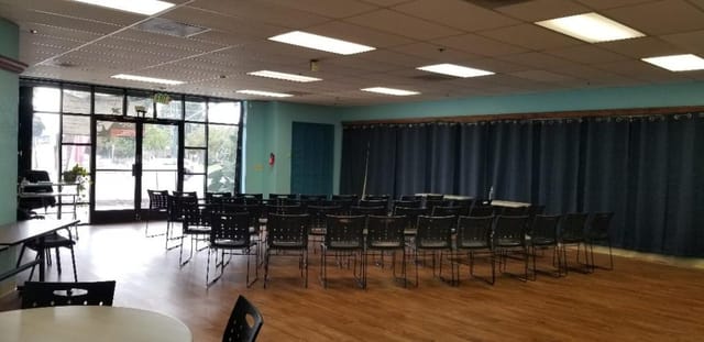 Versatile meeting space with chairs for workshops and seminars at Us Together Center.