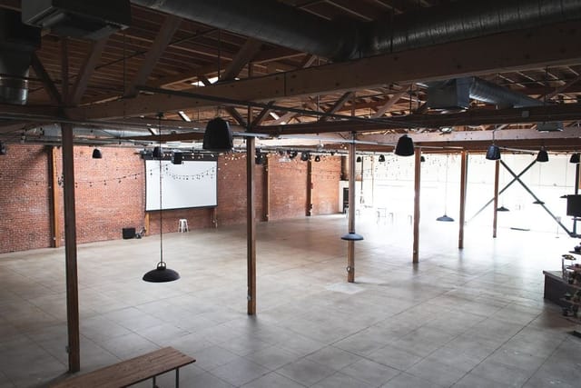 Guildhouse Event Space with exposed brick, ideal for corporate meetings and workshops.