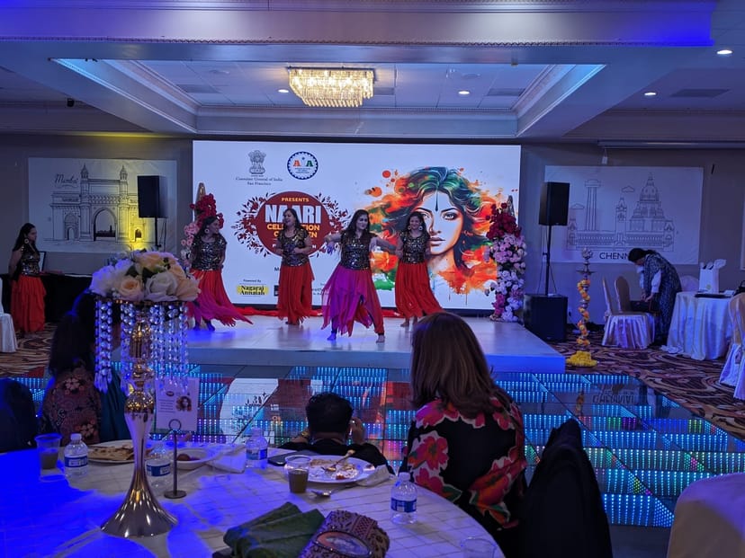 Vibrant event space with stage performers at Shubham Halls for cultural celebration.