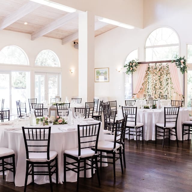 Elegant Resham Event Center with round tables, ideal for weddings and gatherings.