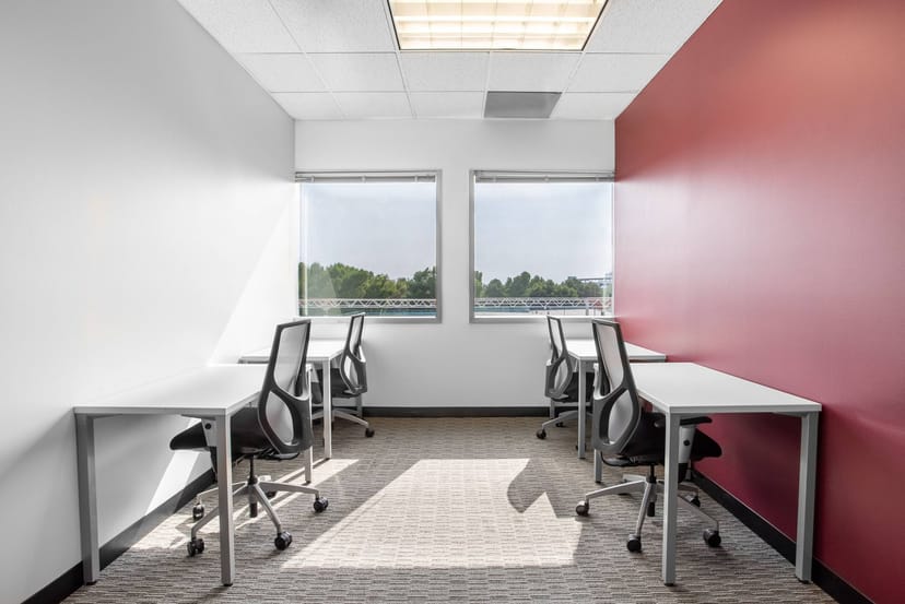 Modern meeting space in Techmart Center, bright and minimalist for collaboration.