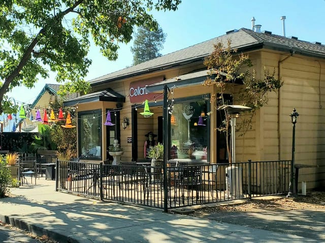 Charming patio venue with colorful decor, perfect for outdoor events and gatherings.